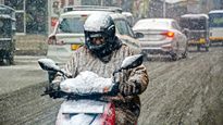 In Pics: Srinagar Welcomes Season's 1st Snowfall, Bringing Joy to Tourists