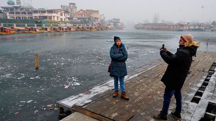 Cold Wave Grips Jammu And Kashmir Freezing Dal Lake And Boosting Tourism