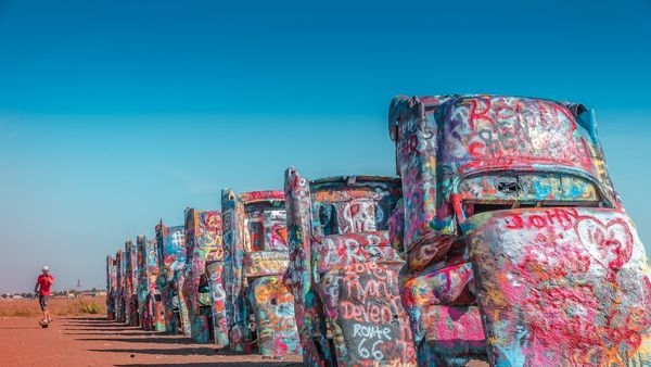 Colorful vintage Cadillacs buried nose-first at Cadillac Ranch Colorful vintage Cadillacs buried nose-first at Cadillac Ranch