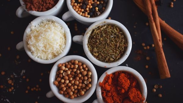 Spices used in Goan cuisine: cumin, coriander, turmeric, and chili peppers Spices used in Goan cuisine: cumin, coriander, turmeric, and chili peppers