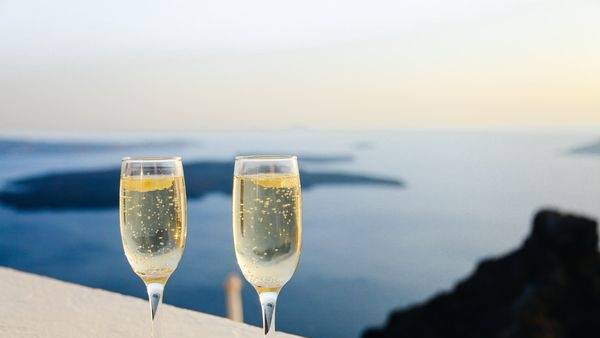 A couple enjoying wine tasting in a Tuscan vineyard