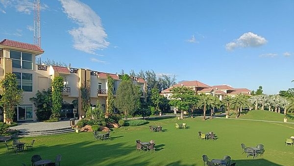 A couple relishing their romantic stay at a luxury resort in Uttarakhand A couple relishing their romantic stay at a luxury resort in Uttarakhand
