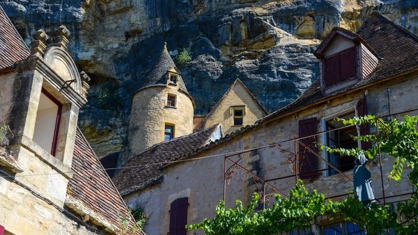 A solo traveler exploring the winding streets of Bergeracs old town A solo traveler exploring the winding streets of Bergeracs old town