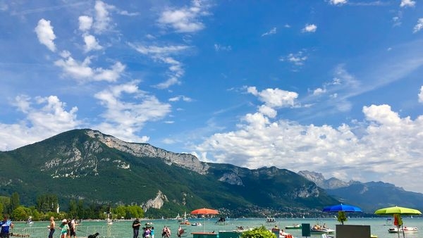 A striking view of Annecy lake with French Alps in the backdrop A striking view of Annecy lake with French Alps in the backdrop