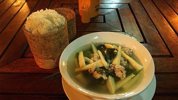 A traditional Mizo meal with Bamboo Shoot Soup, Mizo Vawksa, and Koat Pitha A traditional Mizo meal with Bamboo Shoot Soup, Mizo Vawksa, and Koat Pitha