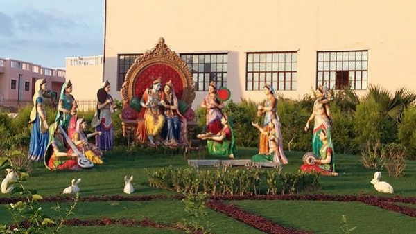 Alt image of the lush, serene garden surrounding Prem Mandir with statues of Lord Krishnas life events Alt image of the lush, serene garden surrounding Prem Mandir with statues of Lord Krishnas life events
