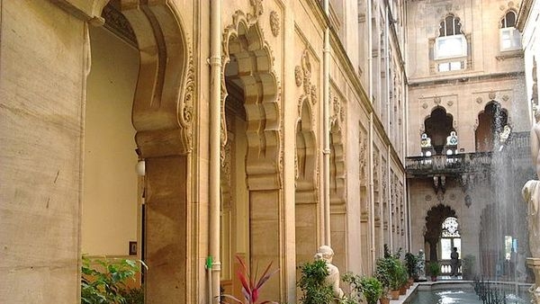 Alt_text: Detailed view of intricate architecture of Laxmi Vilas Palace Alt_text: Detailed view of intricate architecture of Laxmi Vilas Palace