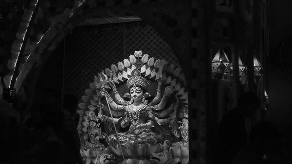 An artistic depiction of an early Durga Puja celebration in Kolkata