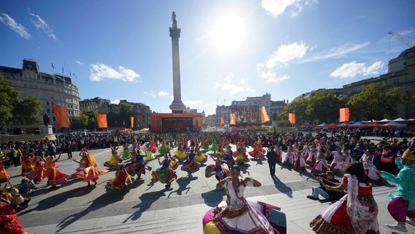 An image depicting grand Diwali celebrations in London with decorative lights, Indian performances, and firework shows. An image depicting grand Diwali celebrations in London with decorative lights, Indian performances, and firework shows.