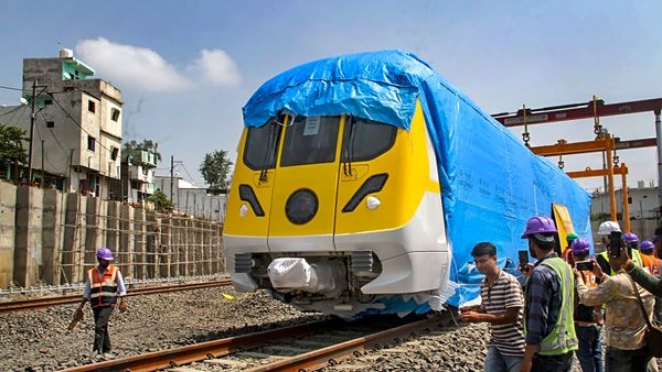 An Indore Metro Train charting along the brand new metro tracks against the stunning backdrop of the cityscape An Indore Metro Train charting along the brand new metro tracks against the stunning backdrop of the cityscape