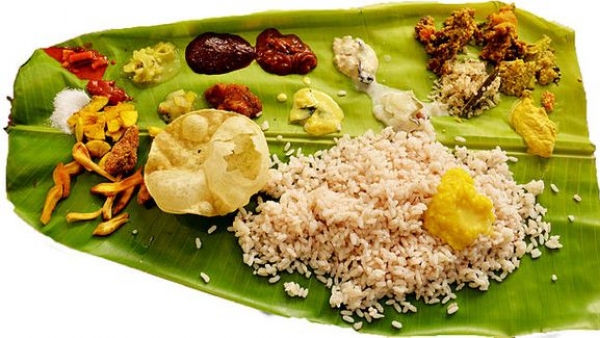 Authentic Kerala cuisine served on a banana leaf Authentic Kerala cuisine served on a banana leaf