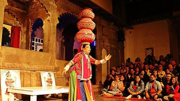 Authentic Rajasthani cuisine with traditional music performance in the backdrop Authentic Rajasthani cuisine with traditional music performance in the backdrop