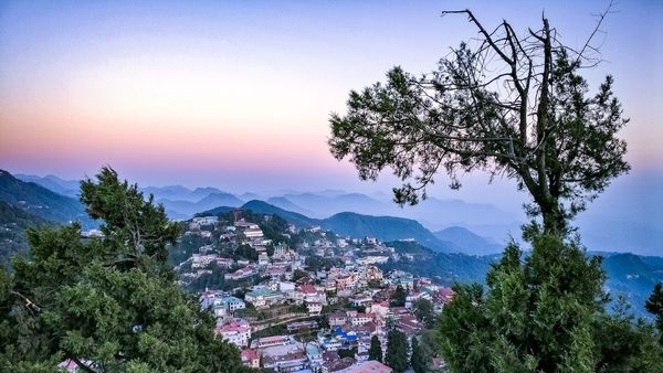 Couple enjoying a serene and romantic evening in Mussoorie Couple enjoying a serene and romantic evening in Mussoorie
