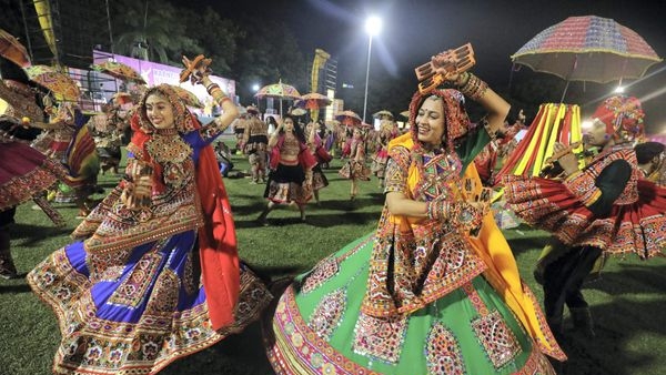 Enthusiastic participants dancing the traditional Dandiya and Garba during Navratri Enthusiastic participants dancing the traditional Dandiya and Garba during Navratri