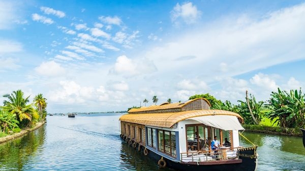 Honeymooners relishing tranquil moments in a houseboat on Alleppeys backwaters. Honeymooners relishing tranquil moments in a houseboat on Alleppeys backwaters.