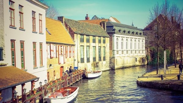 A picturesque view of Bruges’ canals and architecture during Autumn