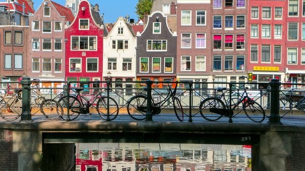 An aerial view of Amsterdam cityscapes and canals. An aerial view of Amsterdam cityscapes and canals.