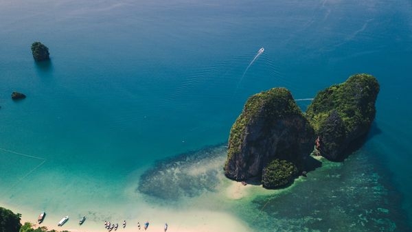 Divers exploring the vibrant marine life in Krabis clear waters