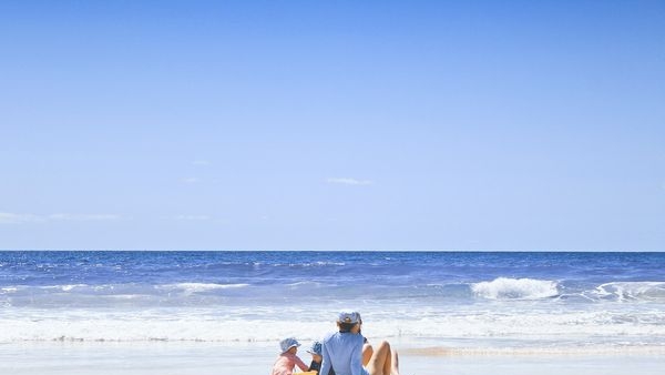 Kids learning about marine life on beach