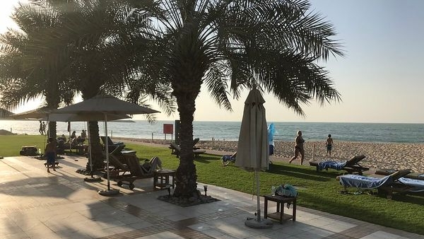 Kids playing on a white-sand beach in Ras Al Khaimah